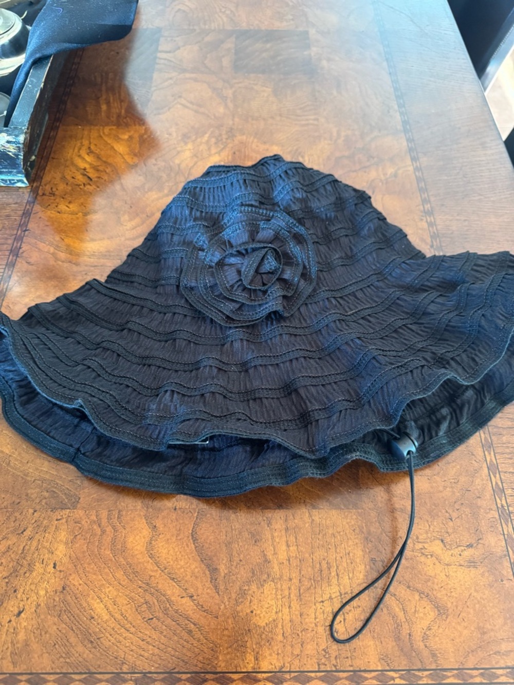 Black Ruffled Sun Hat with Floral Accent